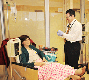 Hematology oncology clinic doctor working with patient