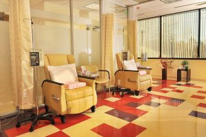 Comfortable yellow chairs with medical machines next to them representing our warm primary care practices as well as our lab testing