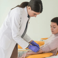 A medical assistant drawing blood, representing our medical assistant jobs