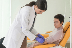 A medical assistant drawing blood, representing our medical assistant jobs