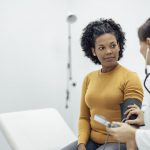 patient getting blood pressure check to prevent top 5 health problems